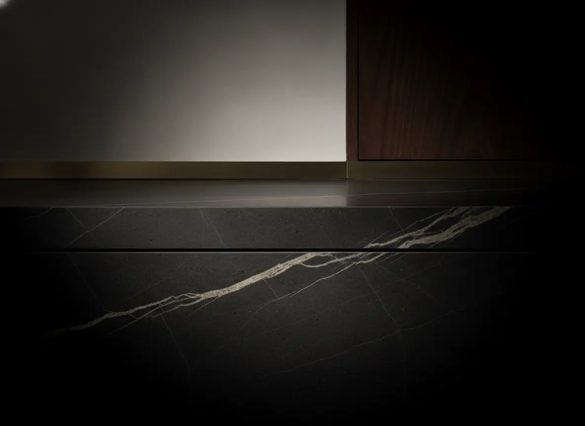 Stone surface detail showing veining carried across a seam — illustrative