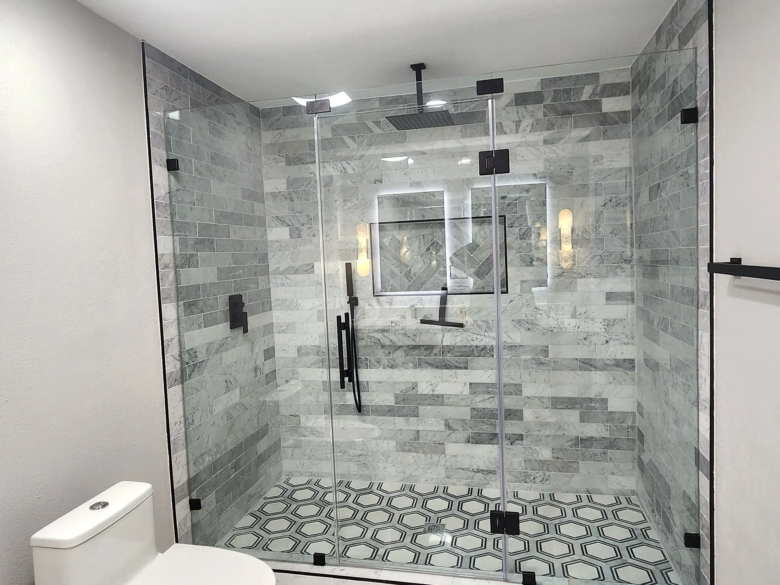 Finished — frameless glass and patterned floor tile